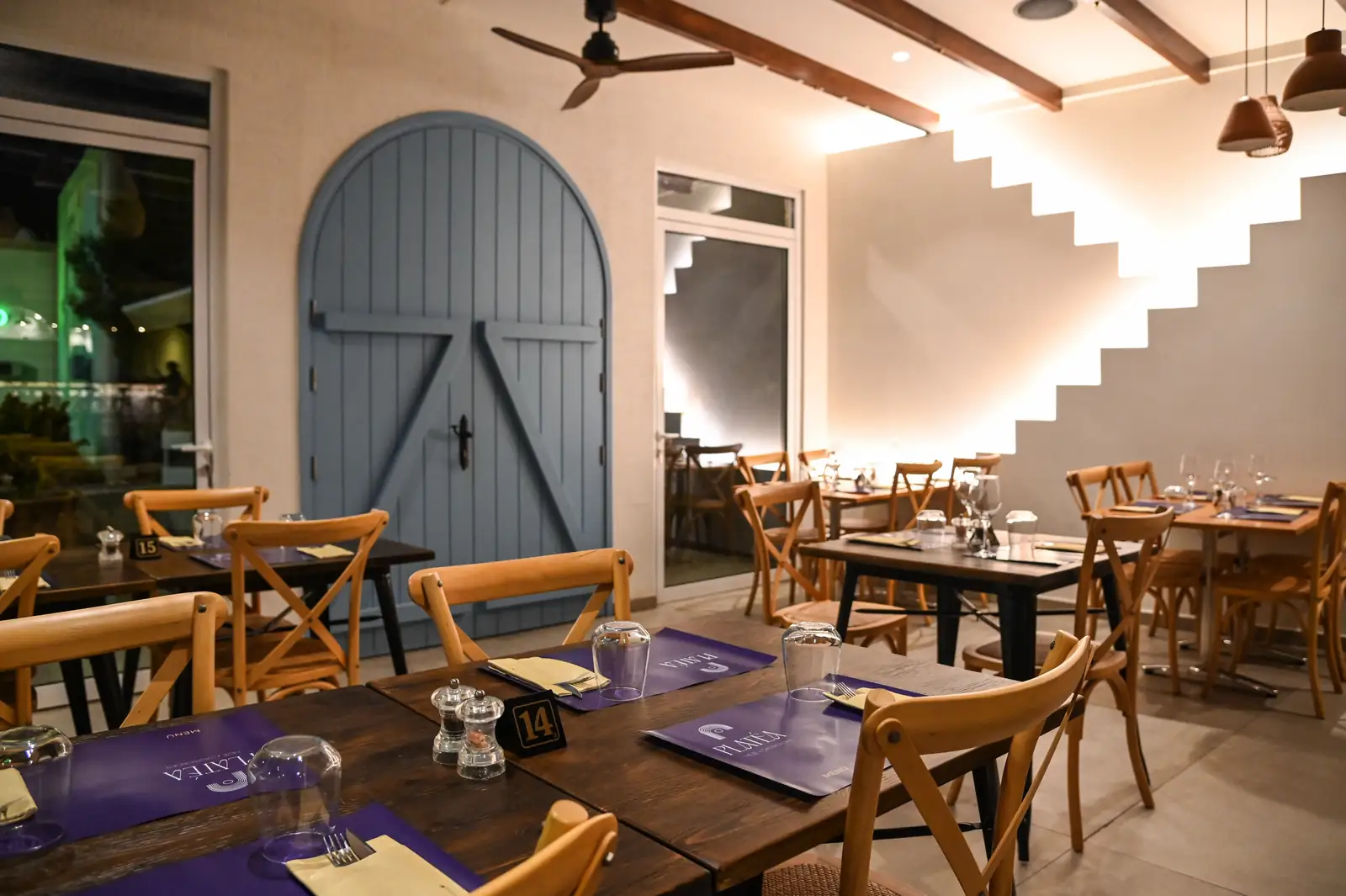 The blue arched door and the stepped light wall at night